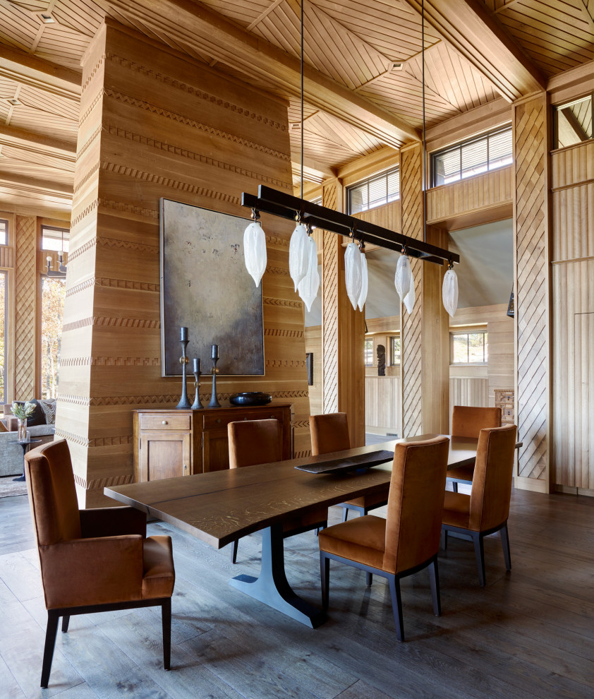 Kitchen/dining room combo - large rustic wood ceiling, wall paneling, dark wood floor, brown floor and wood wall kitchen/dining room combo idea with brown walls