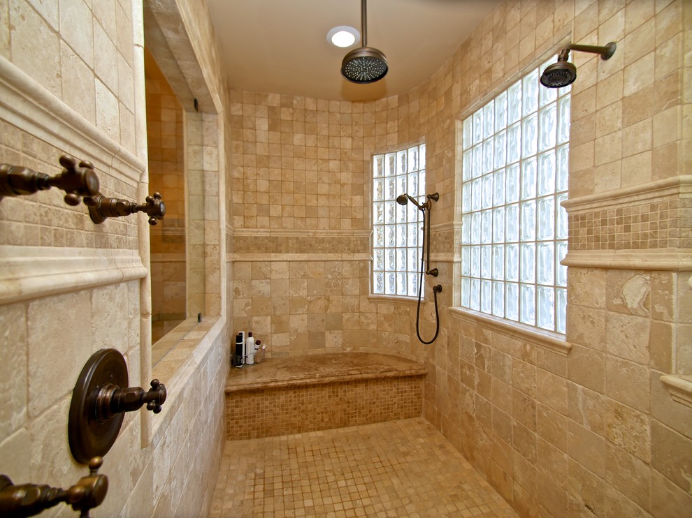 Inspiration for a mid-sized mediterranean master bathroom in Phoenix with recessed-panel cabinets, light wood cabinets, a drop-in tub, a double shower, a two-piece toilet, beige tile, stone tile, beige walls, travertine floors, a pedestal sink and granite benchtops.