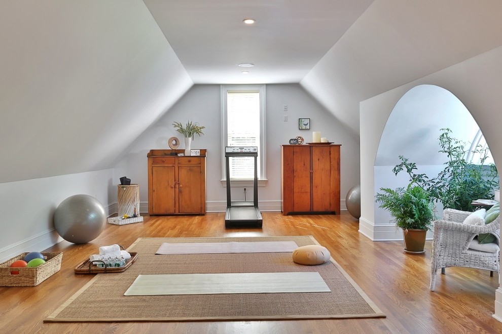 Design ideas for a mid-sized traditional home yoga studio in New York with white walls.
