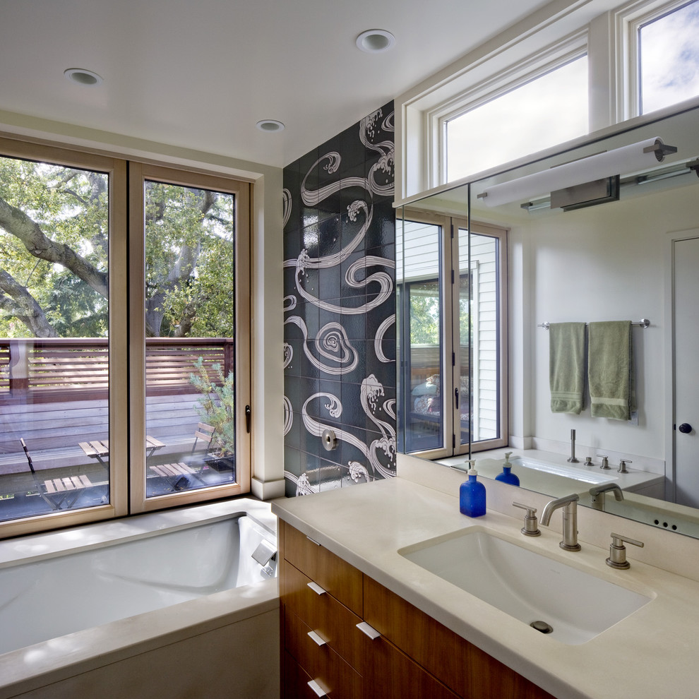 Design ideas for a contemporary bathroom in San Francisco with limestone benchtops.