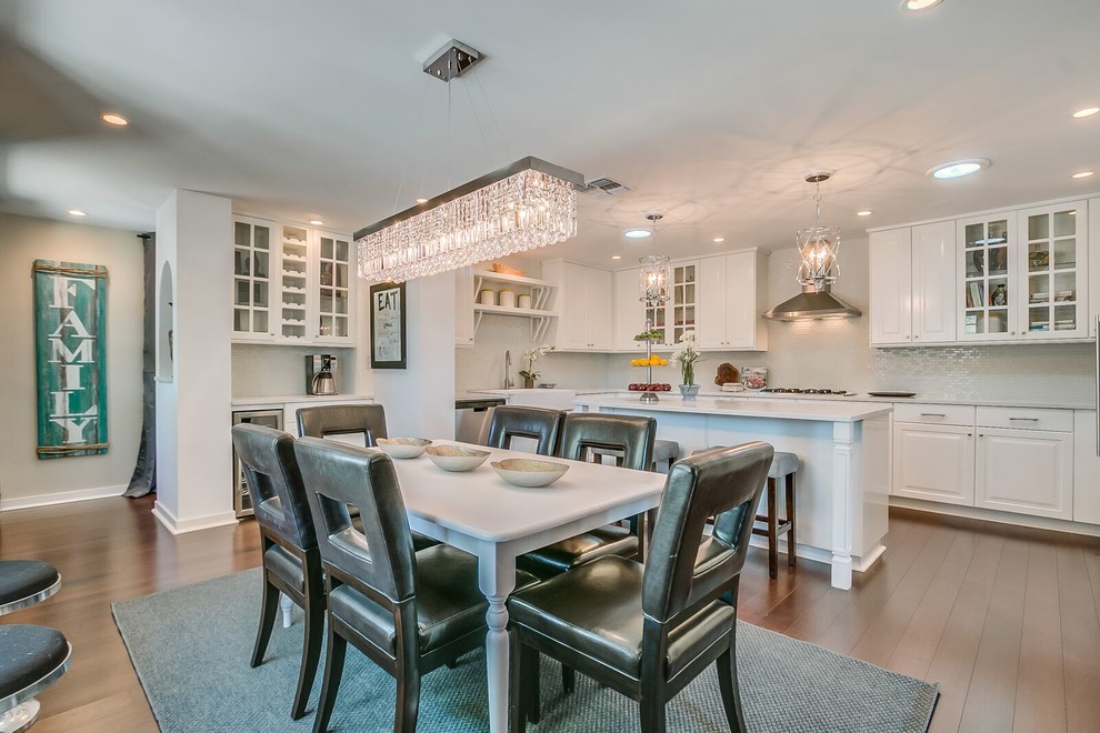 Kitchen/dining room combo - mid-sized transitional medium tone wood floor and brown floor kitchen/dining room combo idea in Phoenix with white walls and no fireplace