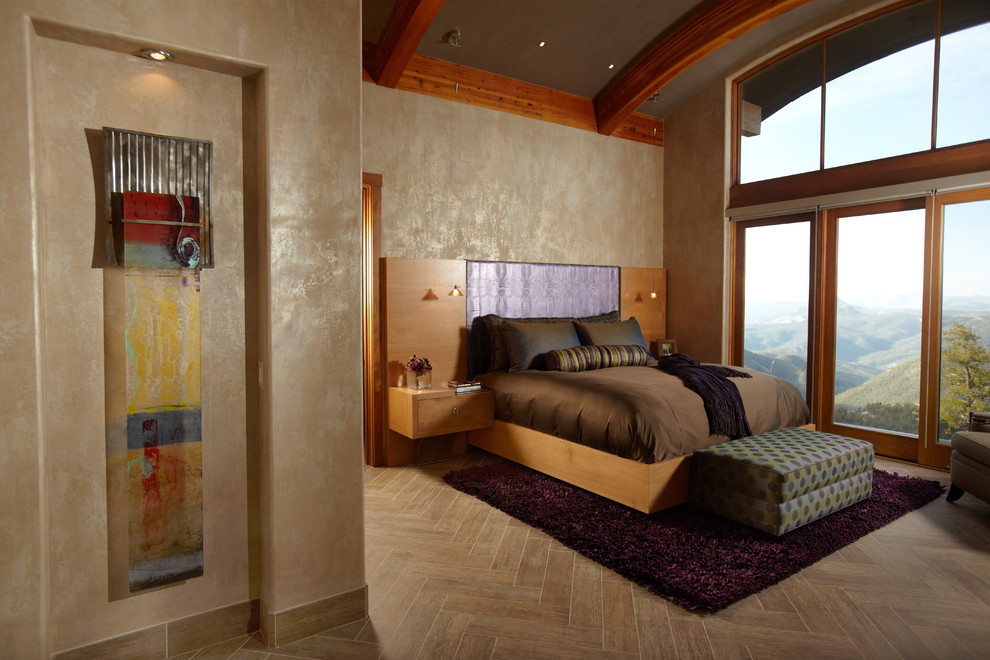 Photo of a contemporary bedroom in Minneapolis with beige walls, medium hardwood floors and beige floor.