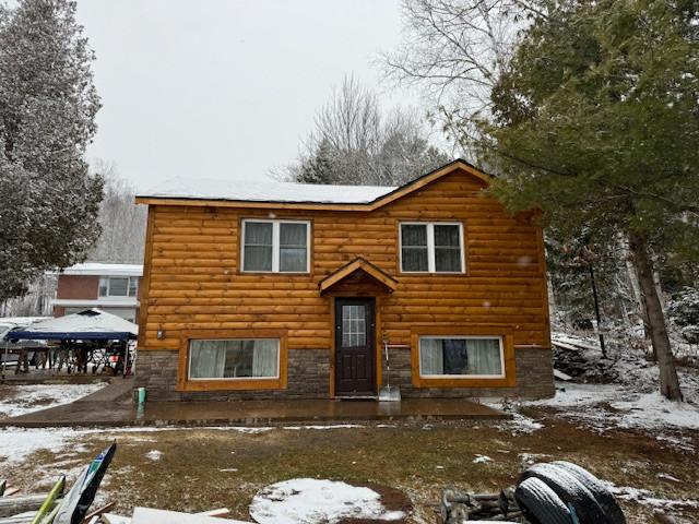 Log Siding, Stamped Concrete and Post and Beam Carport