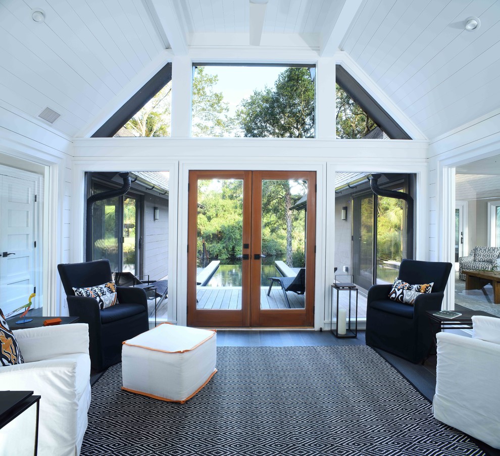 Large contemporary sunroom in Charleston with dark hardwood floors and a standard ceiling.