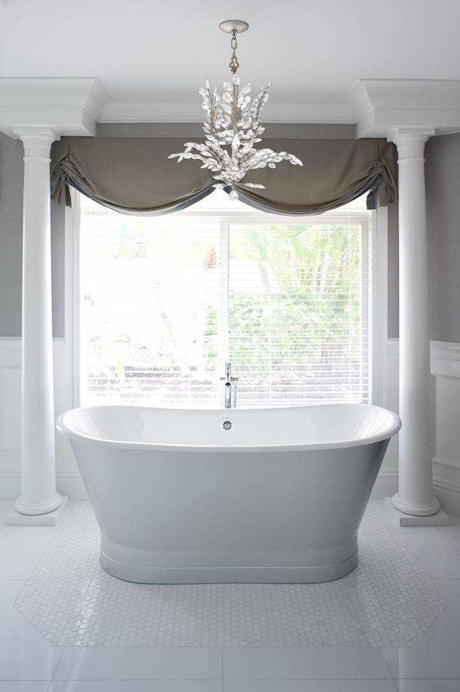 Freestanding bathtub - transitional mosaic tile floor freestanding bathtub idea in Miami with gray walls