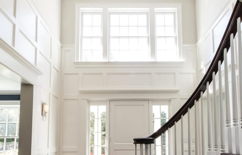 Inspiration for a mid-sized modern front door remodel in New York with white walls and a white front door