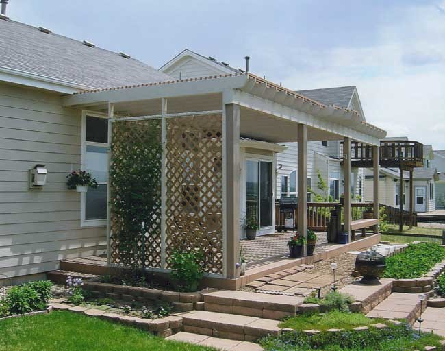 Transitional backyard deck photo in Denver