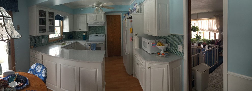 Kitchen - mid-sized light wood floor kitchen idea in Minneapolis with an undermount sink and white appliances