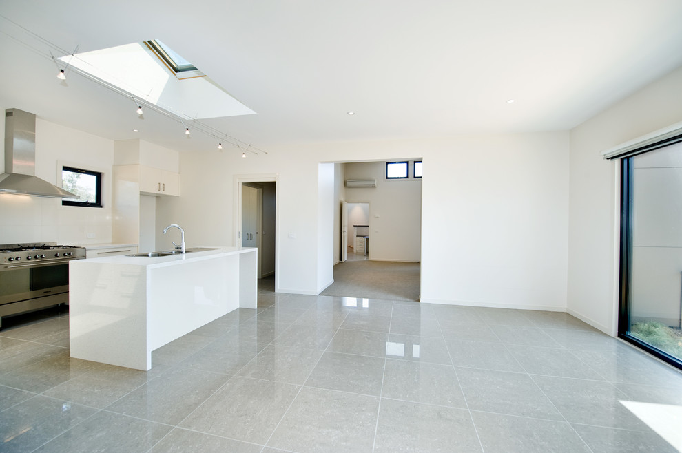 This is an example of a modern living room in Melbourne with ceramic floors.