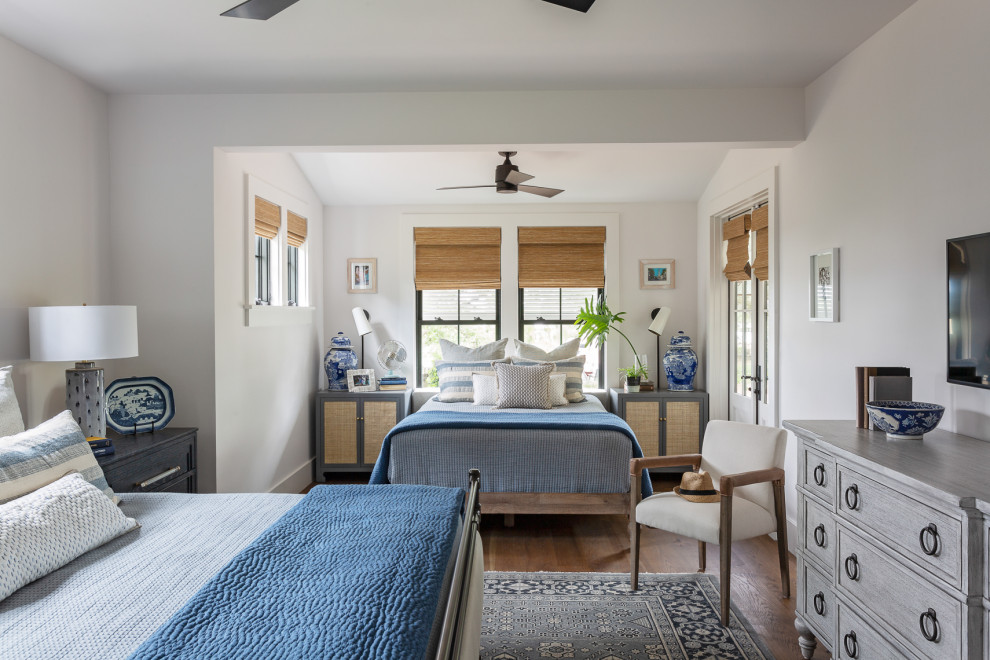 Example of a transitional gender-neutral medium tone wood floor and brown floor kids' room design in Charleston with white walls