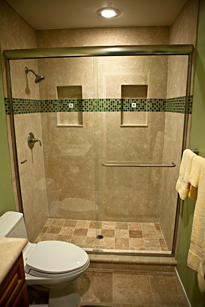 Small transitional kids bathroom in Orange County with an undermount sink, raised-panel cabinets, medium wood cabinets, solid surface benchtops, a corner shower, a two-piece toilet, beige tile, porcelain tile, green walls and porcelain floors.