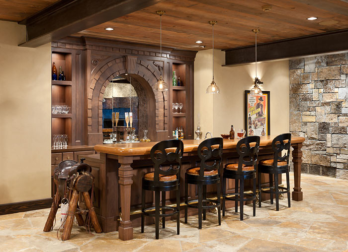 This is an example of a mid-sized country home bar in Other.