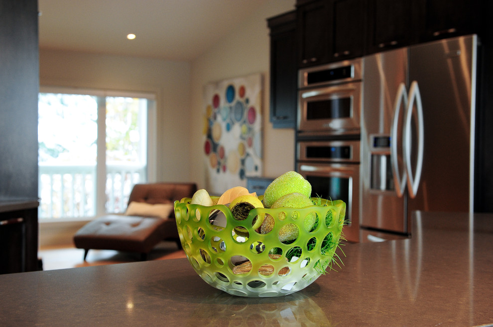 Example of a transitional home design design in Calgary