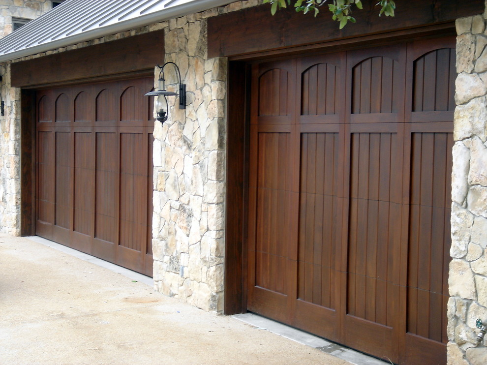 This is an example of a large mediterranean attached two-car garage in Austin.