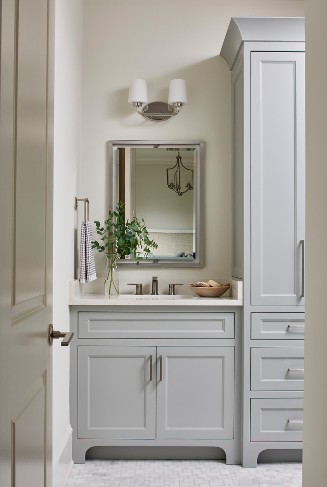 This is an example of a medium sized classic bathroom in Atlanta with recessed-panel cabinets, grey cabinets, an alcove shower, a two-piece toilet, grey tiles, white walls, mosaic tile flooring, a submerged sink, engineered stone worktops, white floors, a sliding door, white worktops, a single sink and a built in vanity unit.