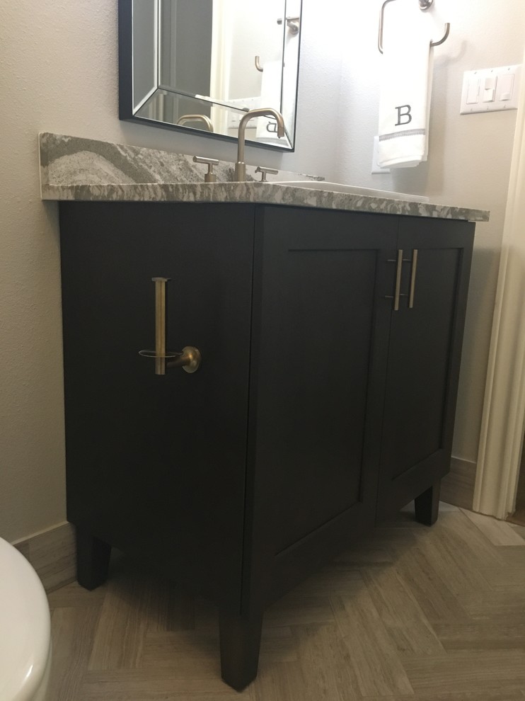 Inspiration for a mid-sized modern 3/4 bathroom in Austin with recessed-panel cabinets, grey cabinets, gray tile, limestone, engineered quartz benchtops, grey walls, limestone floors and an undermount sink.