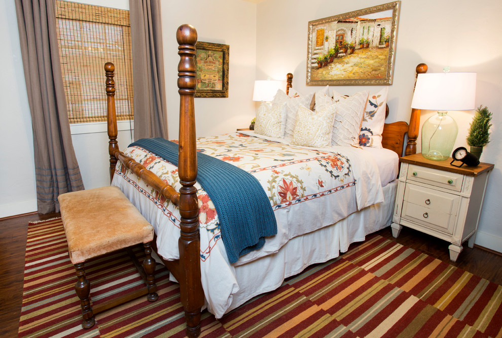 Inspiration for a traditional bedroom in Little Rock with white walls and dark hardwood floors.