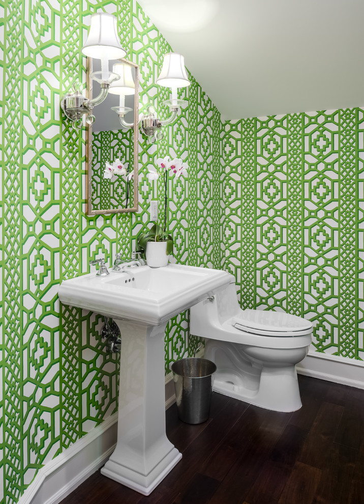 Transitional powder room in Other with a one-piece toilet, green walls, dark hardwood floors, a console sink and white benchtops.