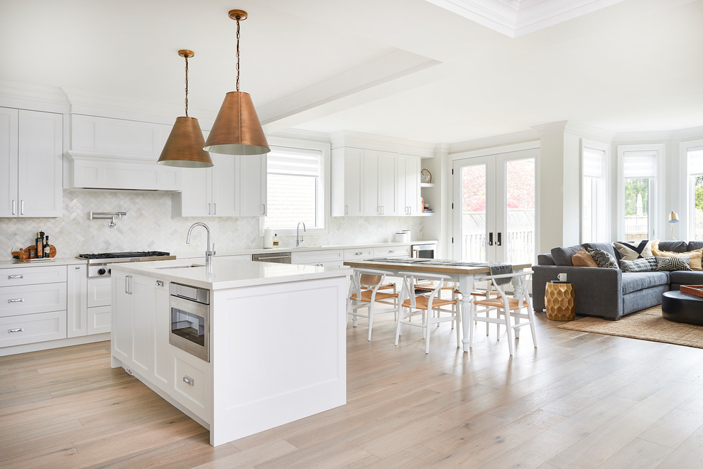 Inspiration for a mid-sized transitional light wood floor and beige floor great room remodel in Toronto with gray walls and no fireplace