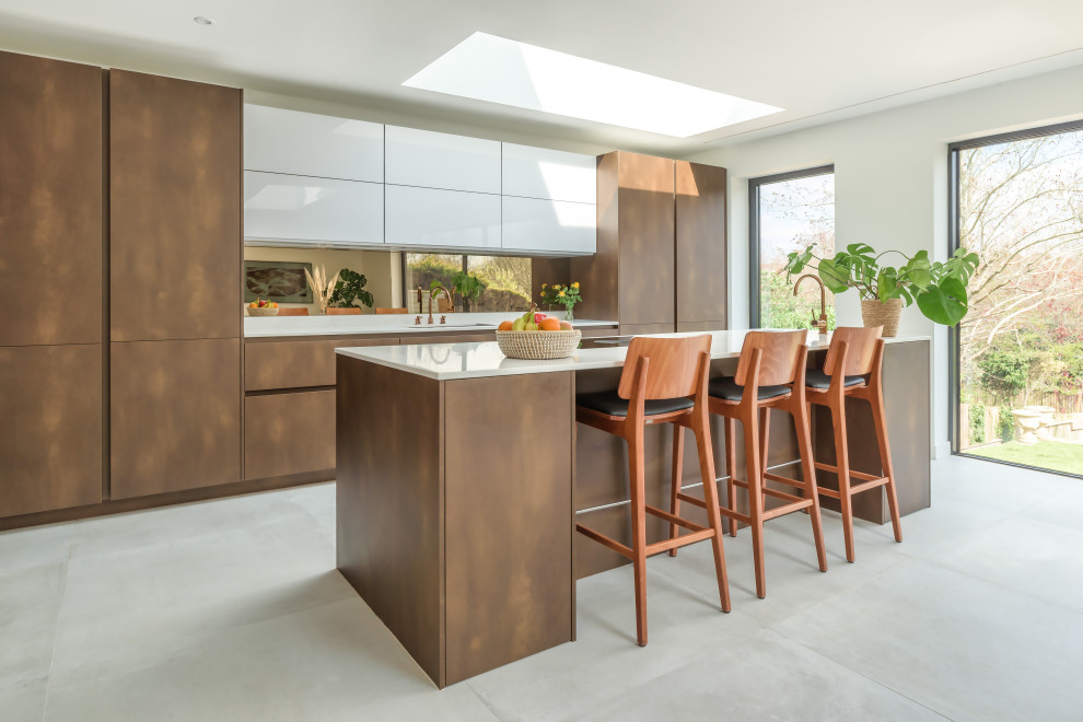 Contemporary single-wall kitchen/diner in Sussex with an island.