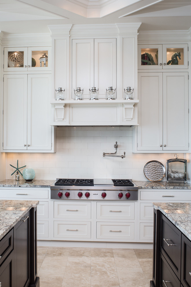 Design ideas for a traditional kitchen in Tampa with recessed-panel cabinets and white splashback.