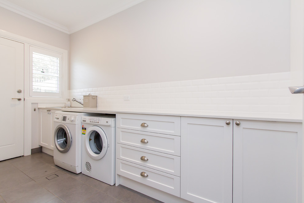 Transitional laundry room in Sydney.