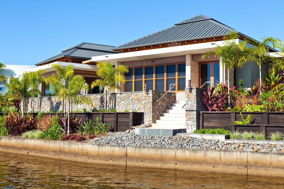 Design ideas for a tropical one-storey exterior in Sunshine Coast.