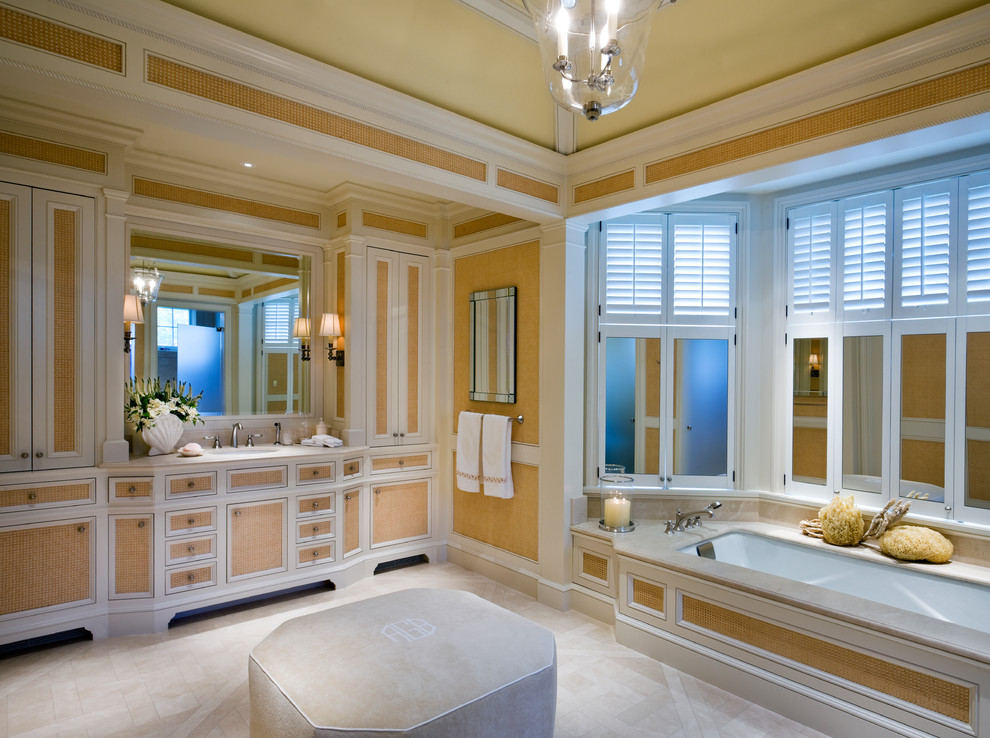 Traditional bathroom in New York with an undermount tub.