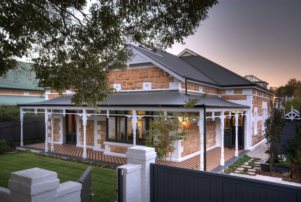 Inspiration for a large traditional one-storey exterior in Adelaide with stone veneer.