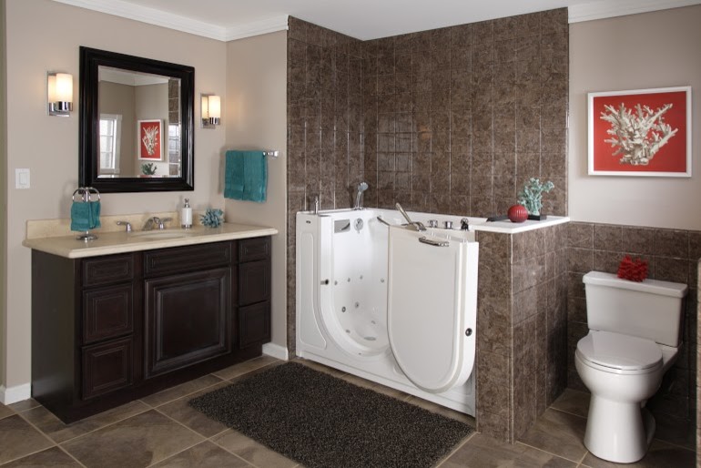 Photo of a mid-sized beach style master bathroom in Other with raised-panel cabinets, dark wood cabinets, an alcove tub, a shower/bathtub combo, an urinal, beige tile, brown tile, gray tile, ceramic tile, beige walls, ceramic floors, an undermount sink and solid surface benchtops.