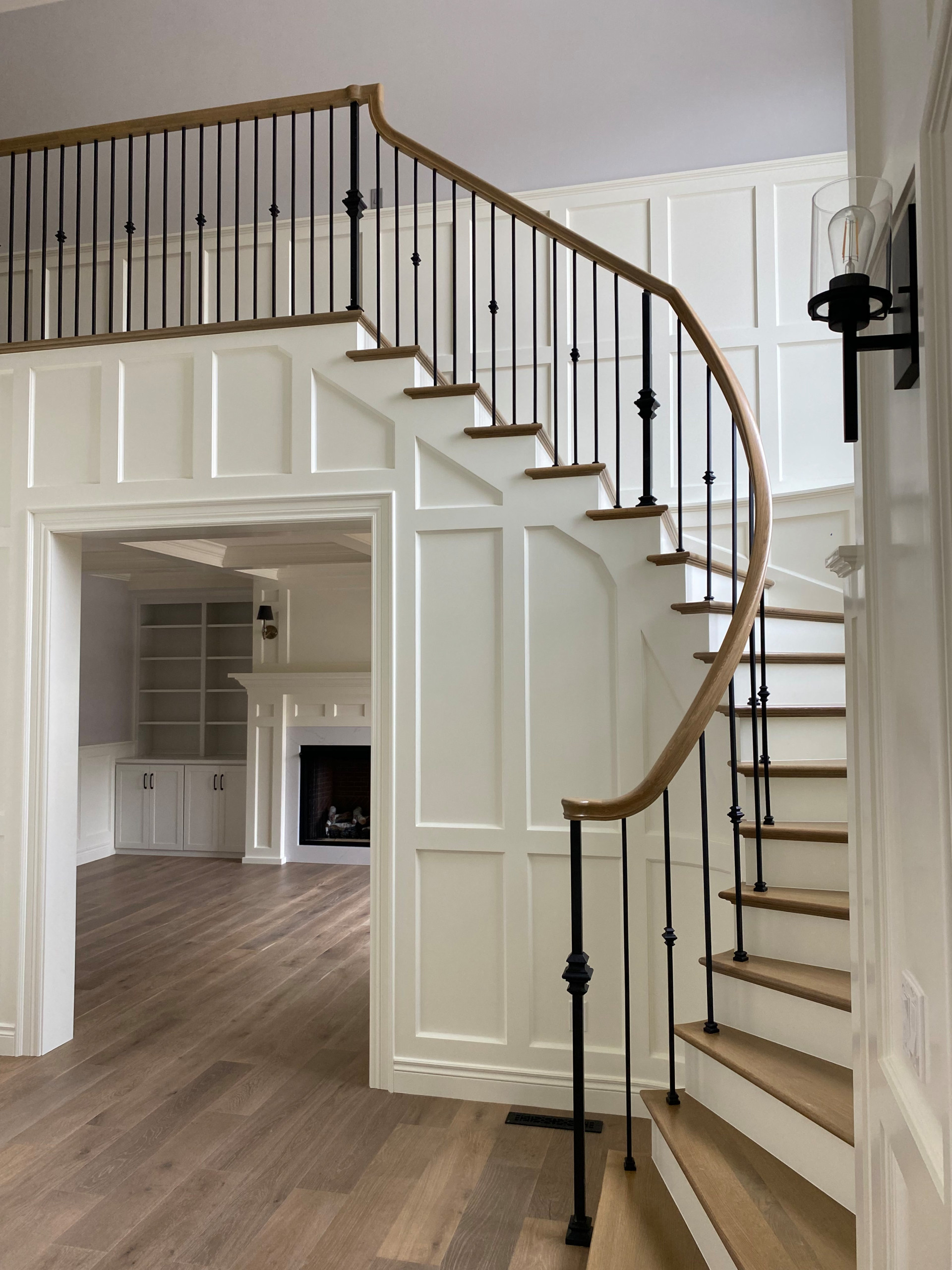Painted and stained stairway with view into office (white painted wainscoting)