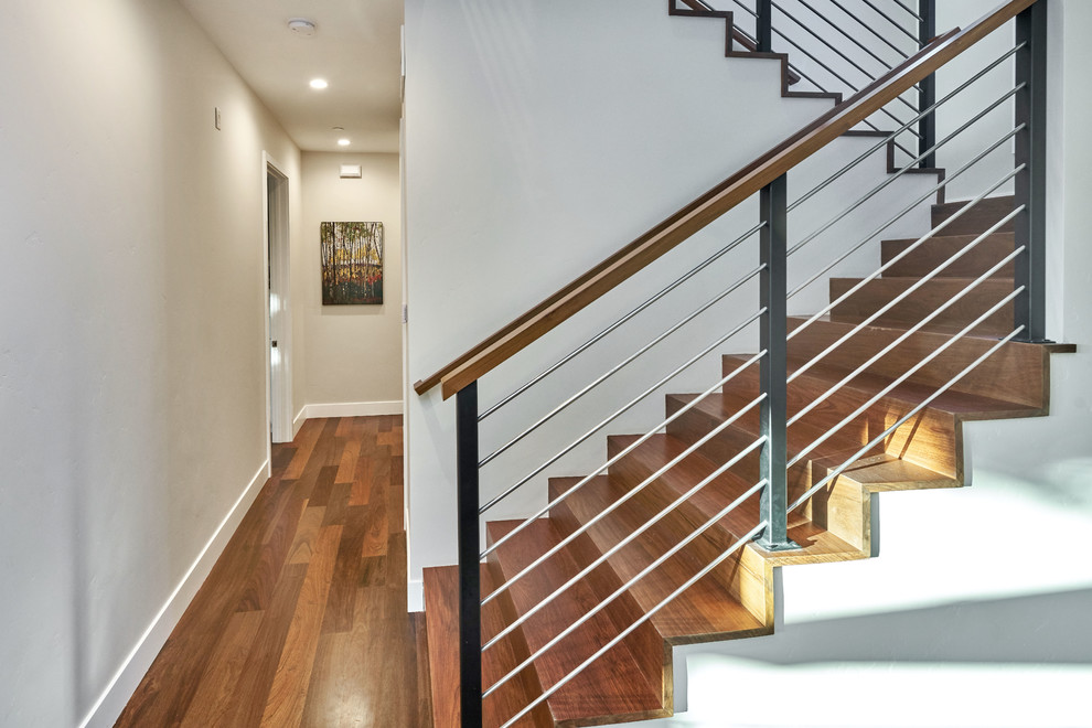 Photo of a mid-sized transitional wood u-shaped staircase in San Francisco with wood risers and mixed railing.