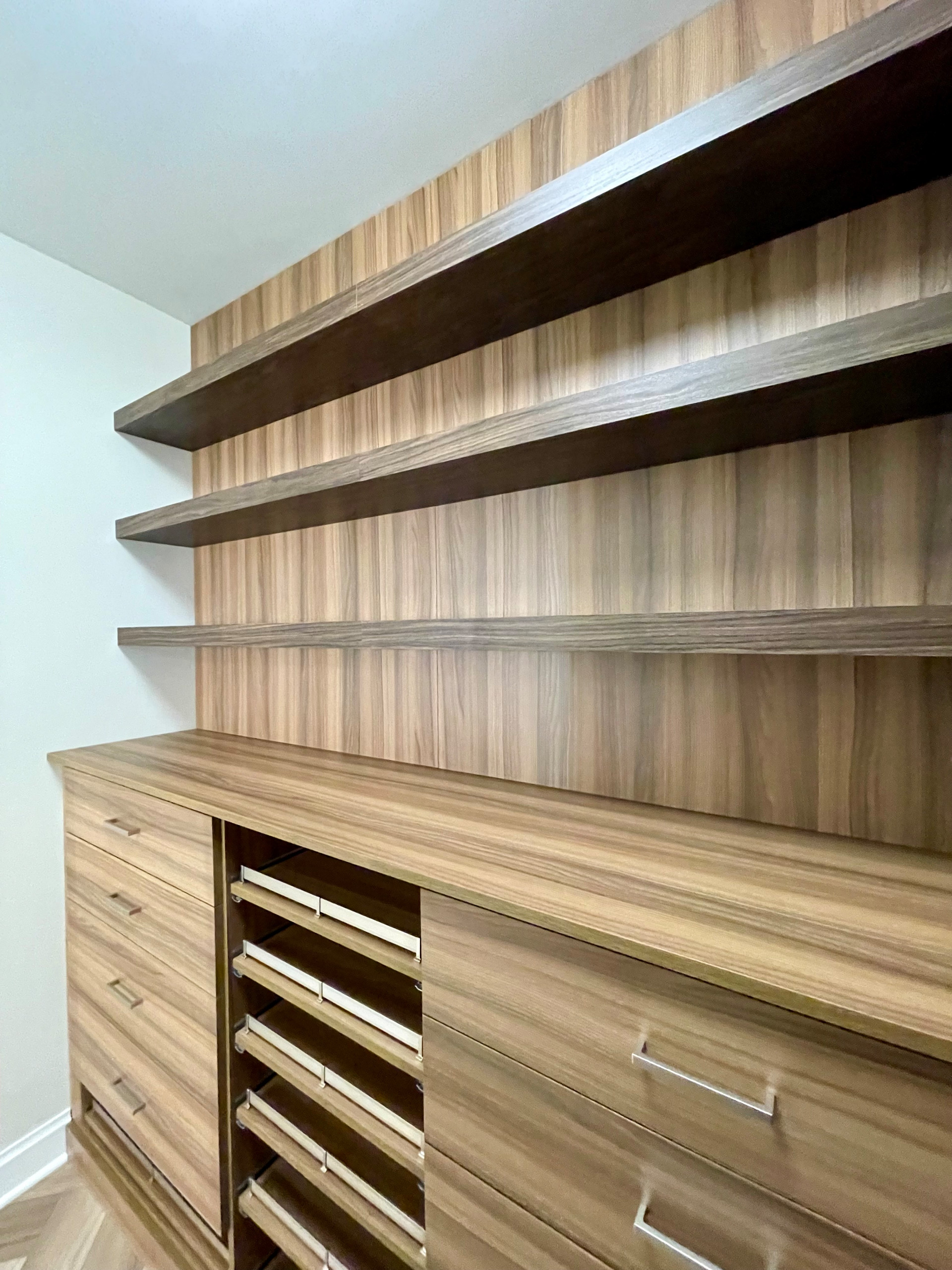 Modern Closet with Floating Shelves and Shoe Pullouts