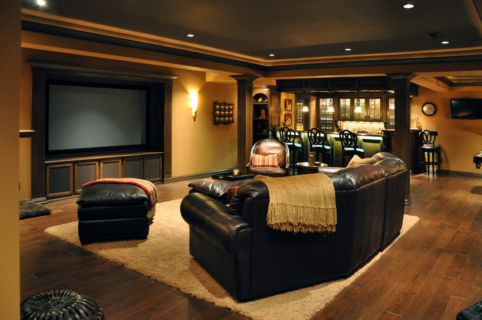 Inspiration for a traditional basement in Cincinnati with yellow walls and dark hardwood floors.
