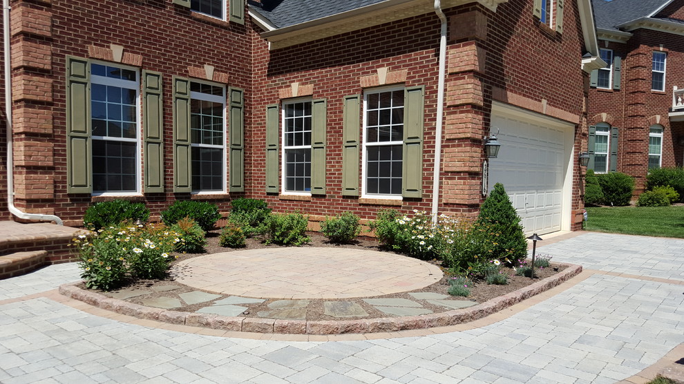 Mid-sized contemporary front yard patio in DC Metro with concrete pavers.
