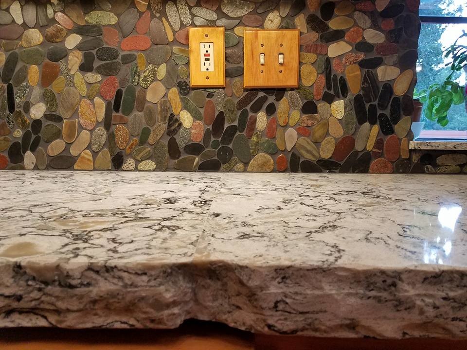 Inspiration for a large rustic u-shaped eat-in kitchen remodel in Sacramento with an undermount sink, raised-panel cabinets, medium tone wood cabinets, quartz countertops, multicolored backsplash, stainless steel appliances and a peninsula