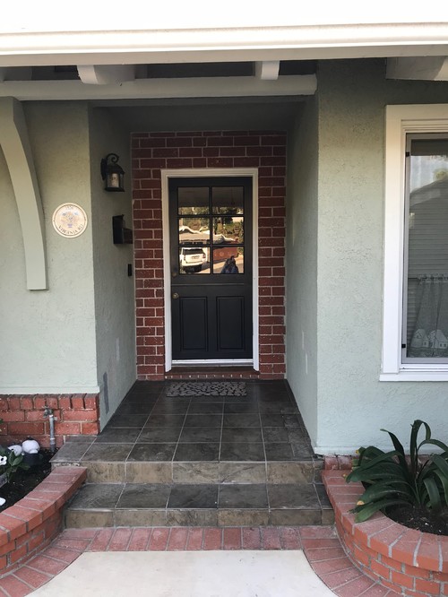 Help-what to do with this brick trim around front door