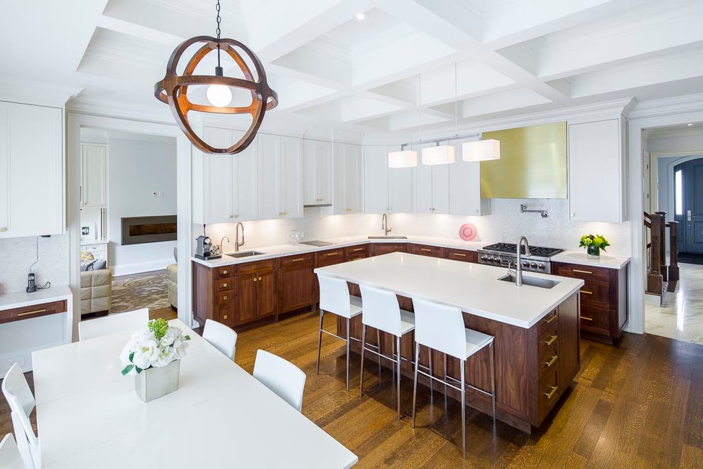 Inspiration for a large transitional l-shaped eat-in kitchen in Toronto with recessed-panel cabinets, medium wood cabinets, dark hardwood floors, with island, quartz benchtops, white splashback, mosaic tile splashback, stainless steel appliances, an undermount sink and brown floor.