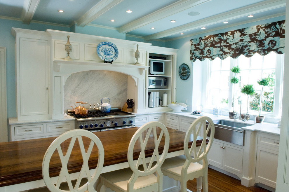 This is an example of a traditional kitchen in DC Metro with wood benchtops.