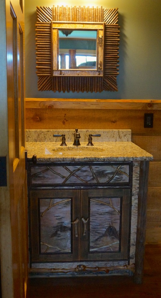 Example of a mountain style home design design in Burlington