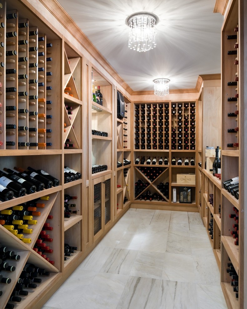 Inspiration for a transitional wine cellar in Toronto with marble floors and storage racks.