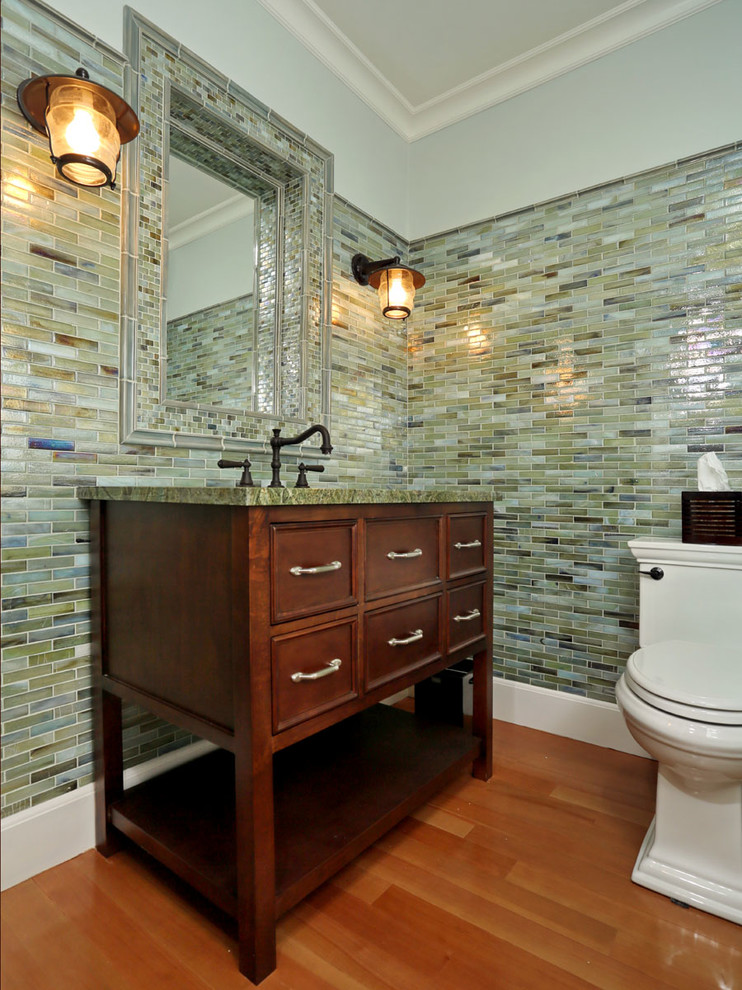 Beach style powder room in Boston with furniture-like cabinets, dark wood cabinets, marble benchtops, multi-coloured tile and green benchtops.