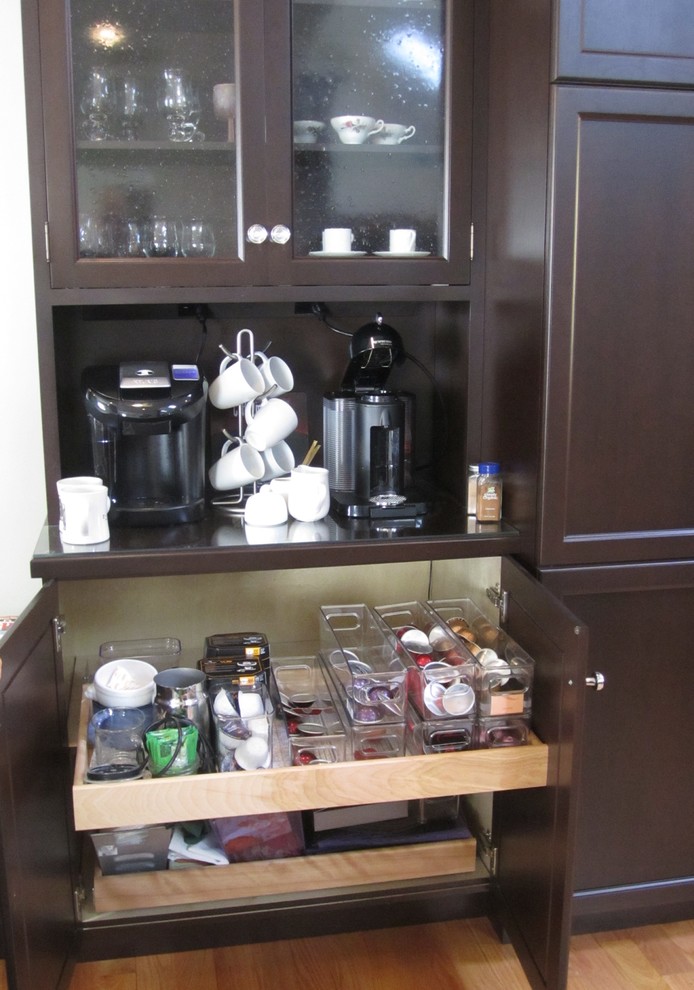 Example of a large transitional l-shaped light wood floor eat-in kitchen design with shaker cabinets, black cabinets, marble countertops, white backsplash, subway tile backsplash, stainless steel appliances and an island