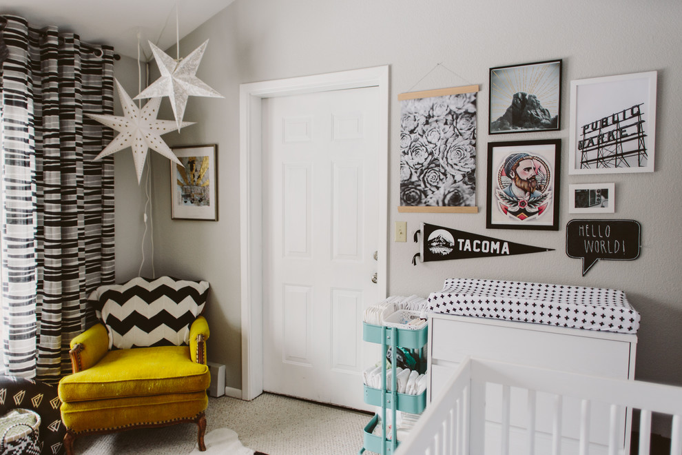 Eclectic gender-neutral nursery in Seattle with grey walls, carpet and white floor.