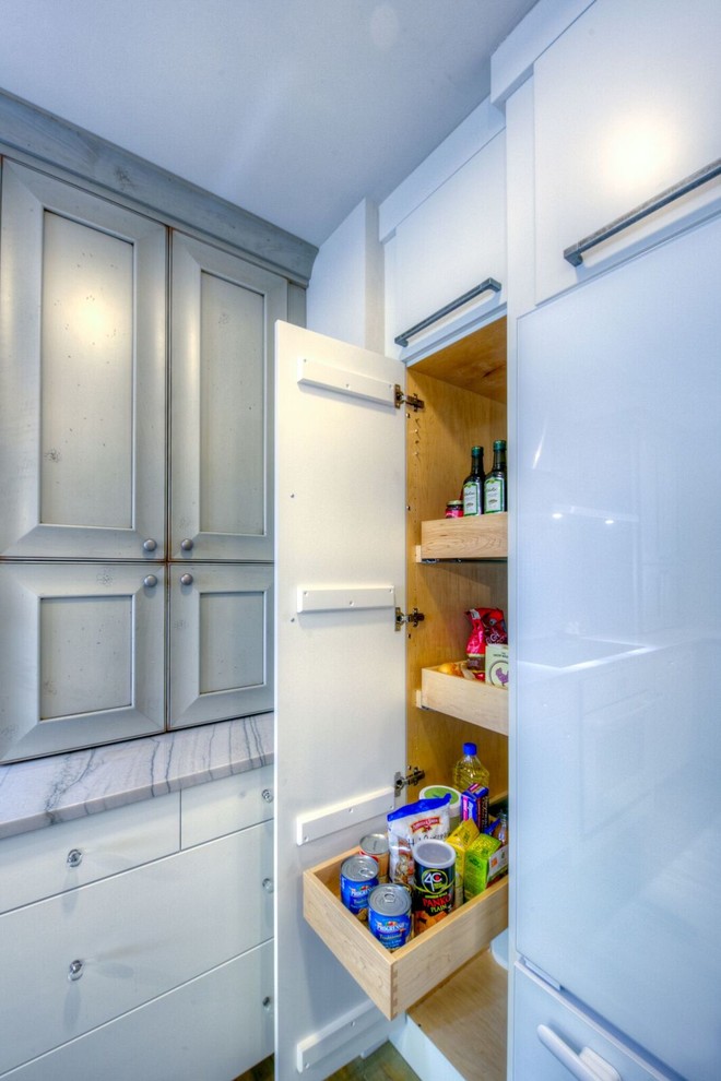 Example of a large transitional u-shaped dark wood floor eat-in kitchen design with a double-bowl sink, flat-panel cabinets, white cabinets, granite countertops, white backsplash, glass tile backsplash, stainless steel appliances and an island