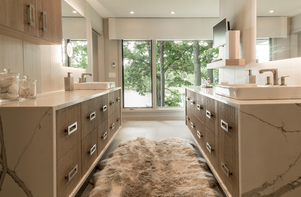 Inspiration for an expansive contemporary master bathroom in Grand Rapids with flat-panel cabinets, light wood cabinets, beige walls, a vessel sink, engineered quartz benchtops, beige floor and white benchtops.