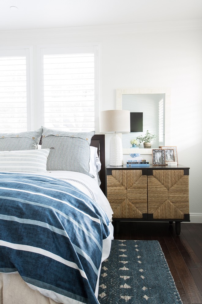 Design ideas for a transitional master bedroom in Sacramento with white walls, dark hardwood floors and brown floor.