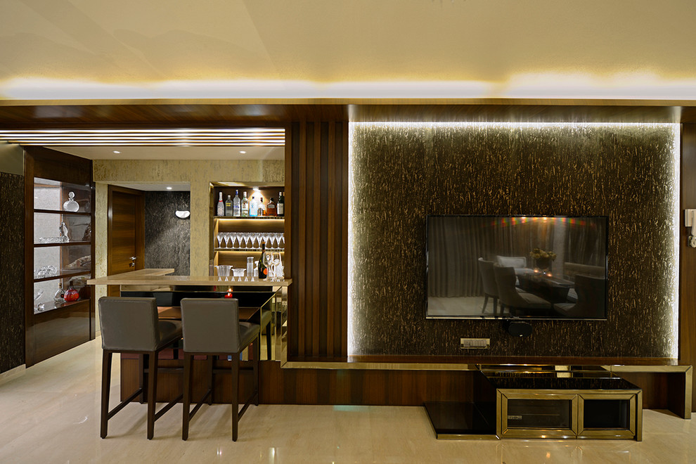 Design ideas for a contemporary home bar in Mumbai.
