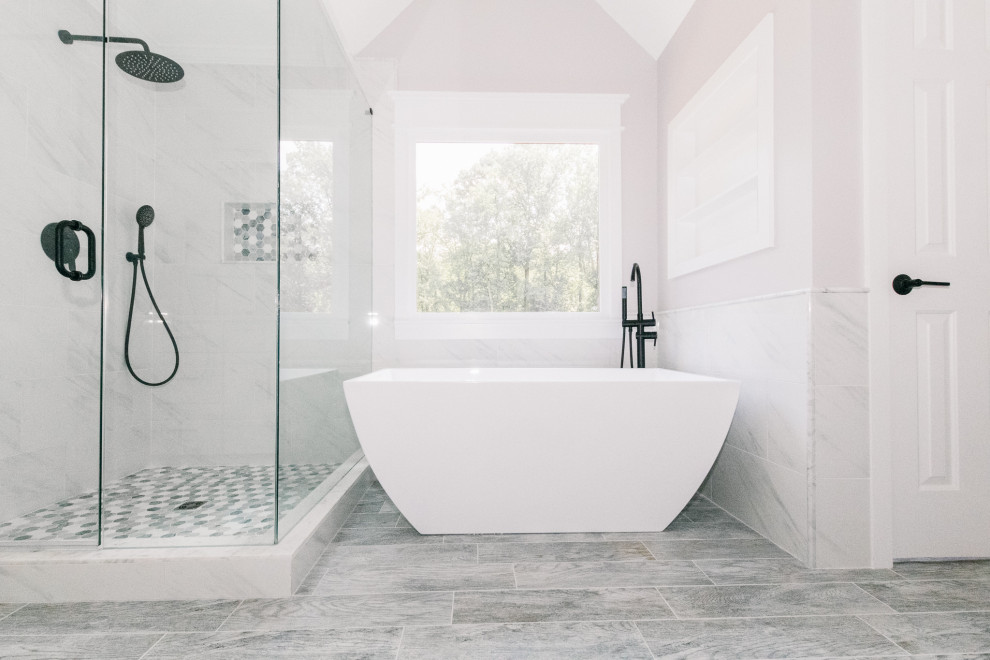 Mid-sized modern master bathroom with shaker cabinets, white cabinets, a freestanding tub, a corner shower, white tile, porcelain tile, purple walls, porcelain floors, an undermount sink, quartzite benchtops, grey floor, a hinged shower door, white benchtops, a niche, a single vanity and vaulted.