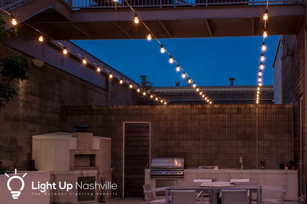 Outdoor kitchen deck - large transitional outdoor kitchen deck idea in Nashville